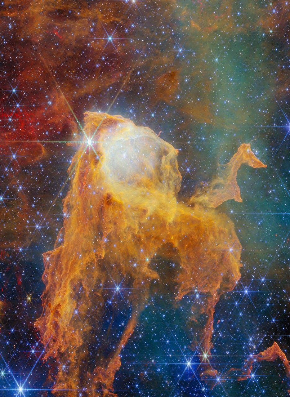 A colorful nebula resembles an open
treasure chest on a field of stars.